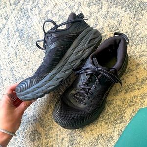 all black Hoka running shoes